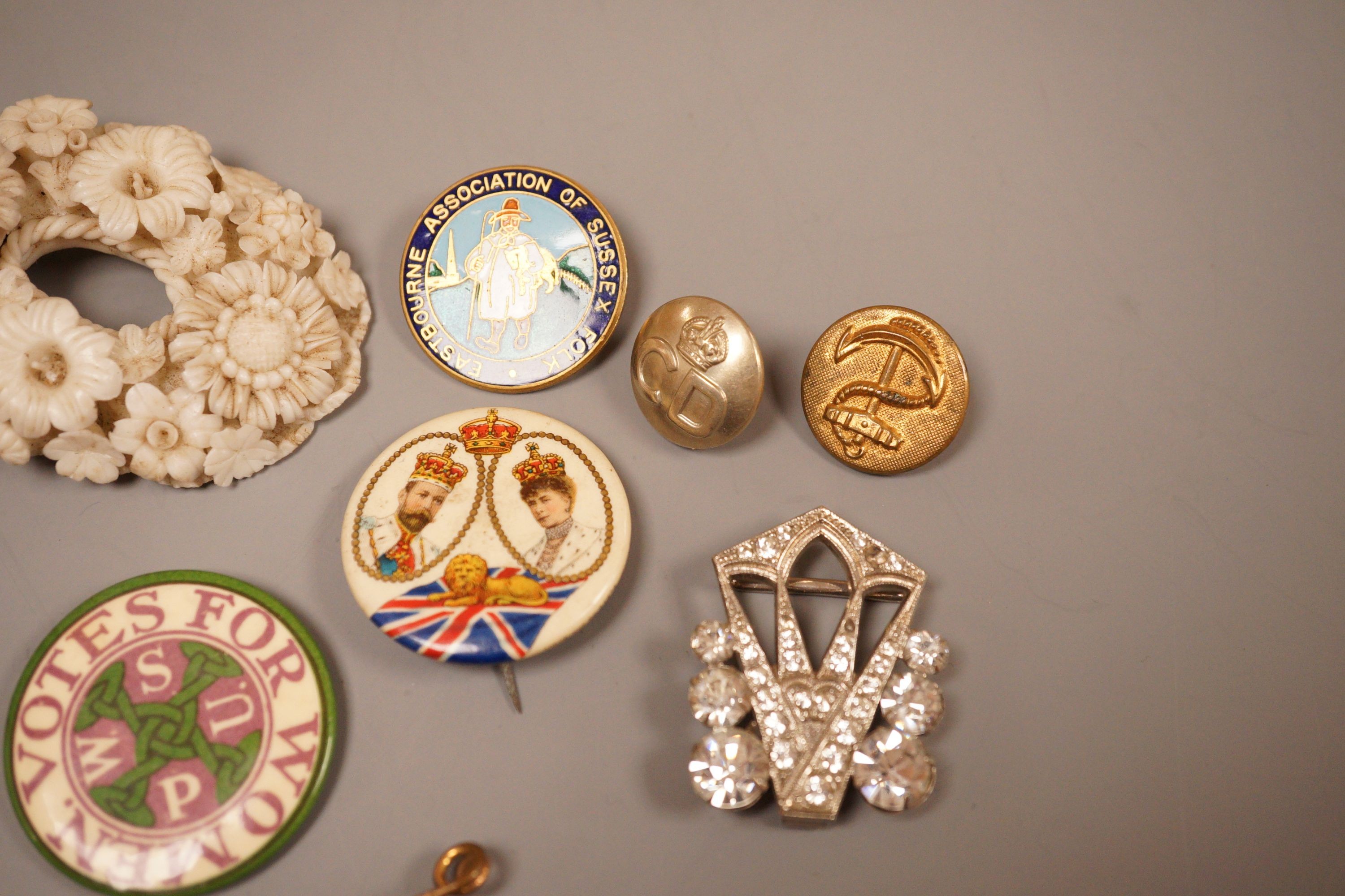 A selection of badges, to include Suffragette Women's Social and Political Union ‘Votes For Women’, Eastbourne Association of Sussex Folk, and others